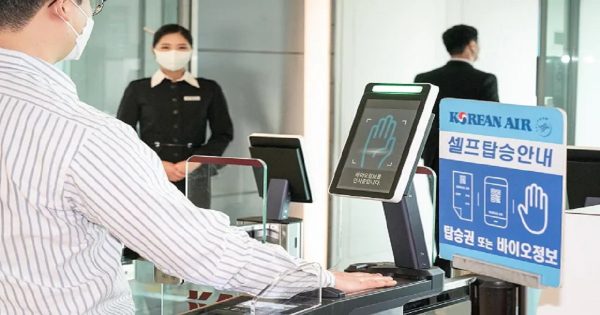 Passenger using Korean Aor biometric self-boarding